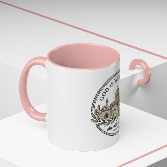 White mug with pink interior and handle, featuring a logo and text on a white background. With the words God is within her, she will not fall. Psalm 46:5.