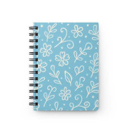 Notebook with floral pattern on a blue background