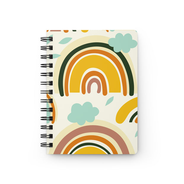 Notebook with rainbow and cloud design on a white background