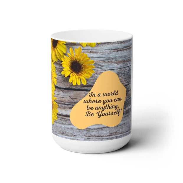 White ceramic 15oz Be Yourself Mug with sunflower design and motivational quote on rustic wood background, microwave and dishwasher safe.