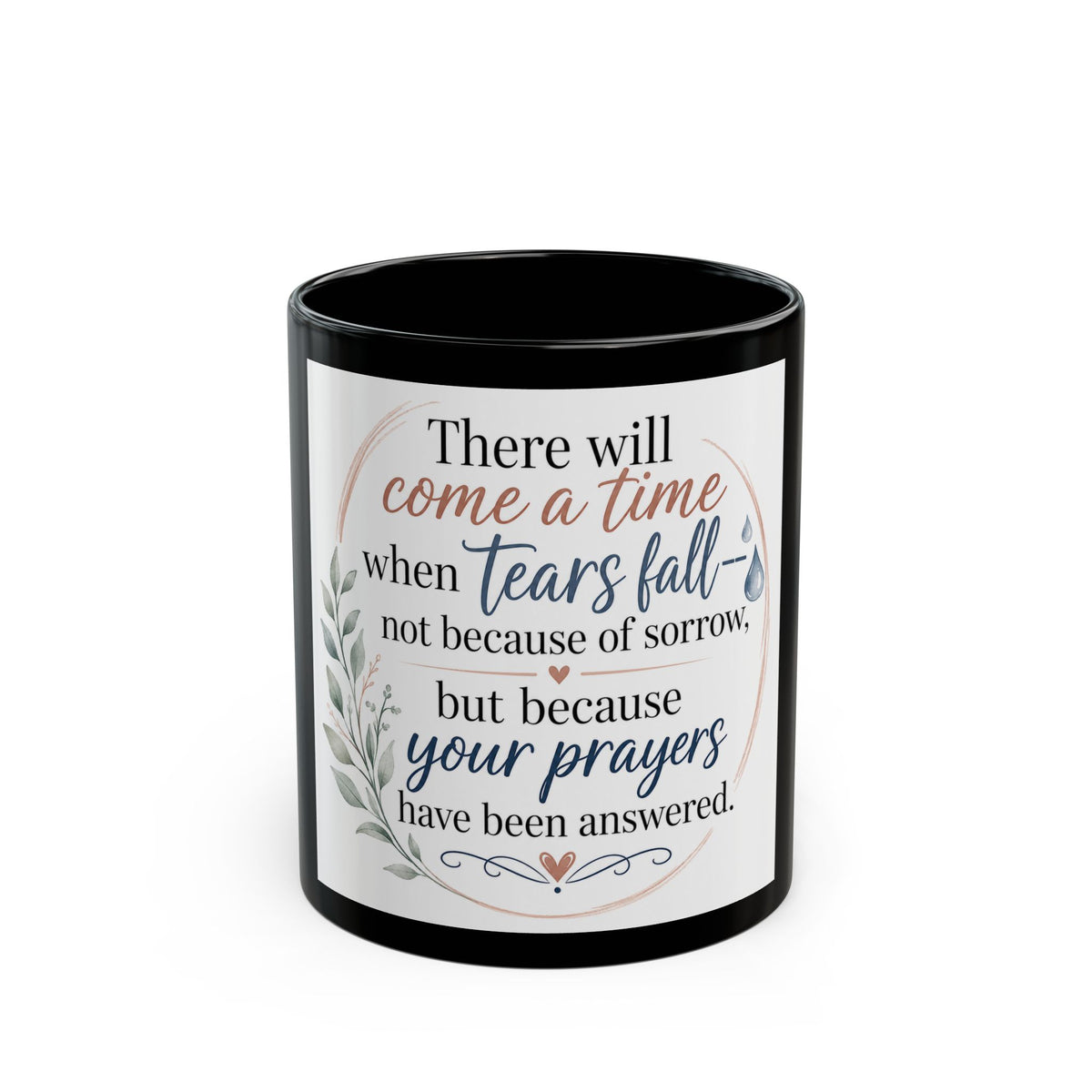 A black ceramic mug with a white printed graphic featuring a comforting quote about tears and prayers, set against a plain white background.