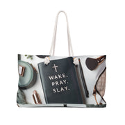 Tote bag with 'Wake. Pray. Slay.' quote and fashion items on a white background