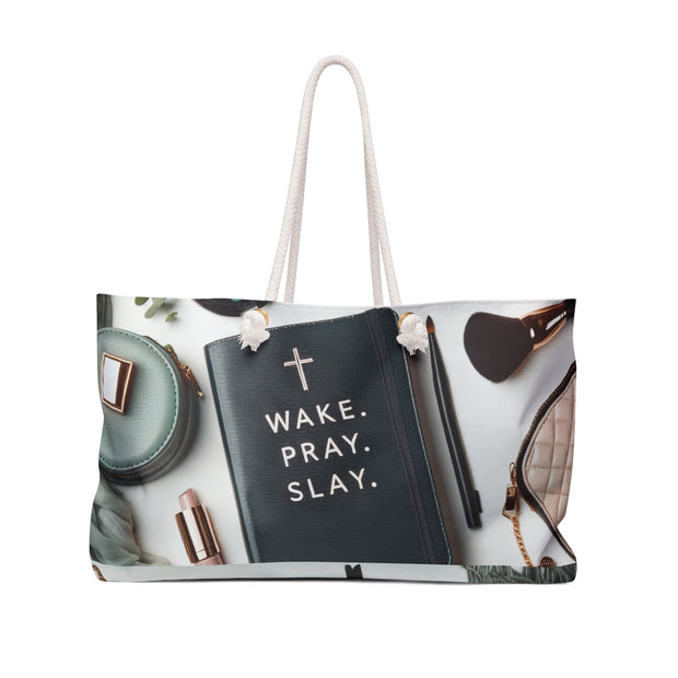 Tote bag with 'Wake. Pray. Slay.' quote and fashion items on a white background
