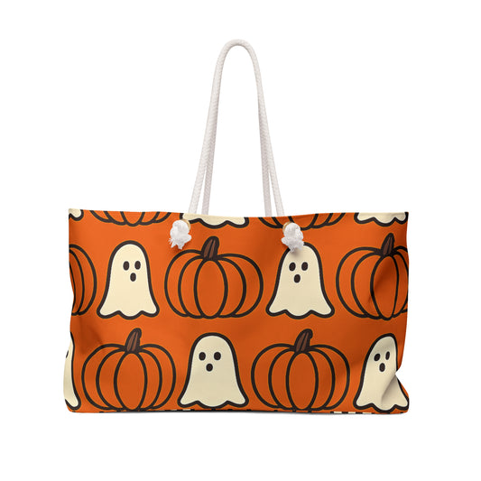Tote bag with Halloween pattern featuring ghosts and pumpkins on an orange background.