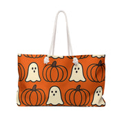 Tote bag with Halloween pattern featuring ghosts and pumpkins on an orange background.