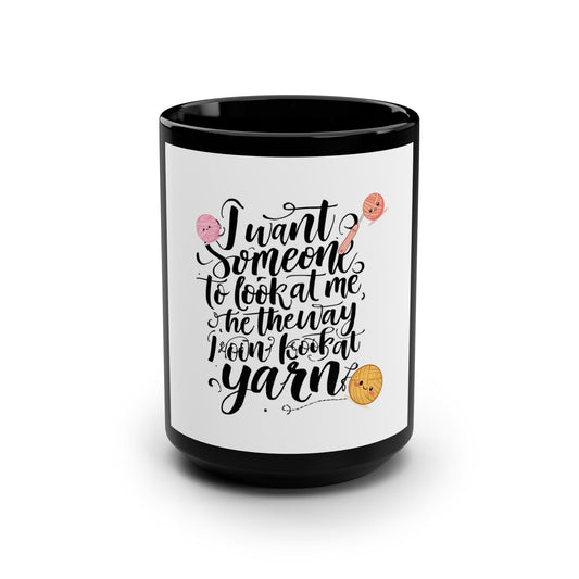 Mug with text and yarn ball graphics on a white background