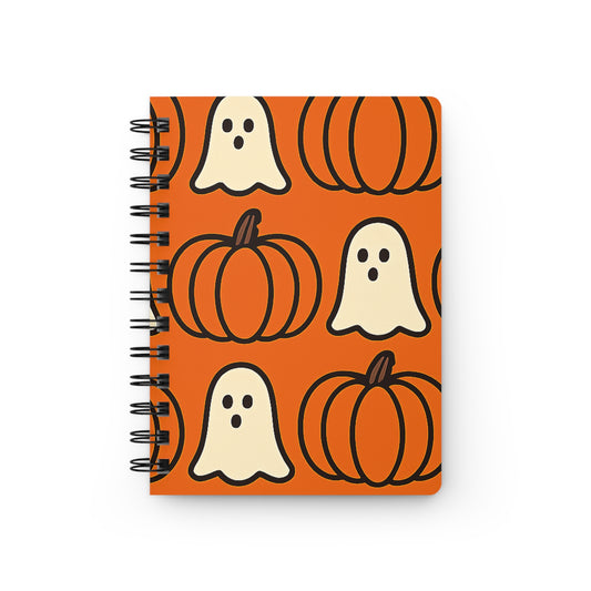 Notebook with Halloween design featuring pumpkins and ghosts on an orange background