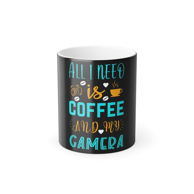 Black color morphing mug with "All I need is coffee and my camera" text, 11oz heat-reactive ceramic coffee cup with C-handle.