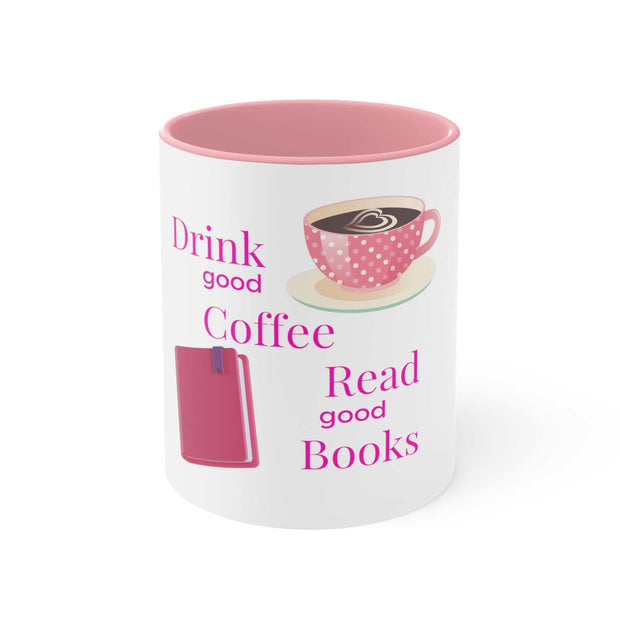 White ceramic mug with pink interior and handle, featuring "Drink good Coffee Read good Books" text and coffee cup illustration, available in 11oz and 15oz sizes.
