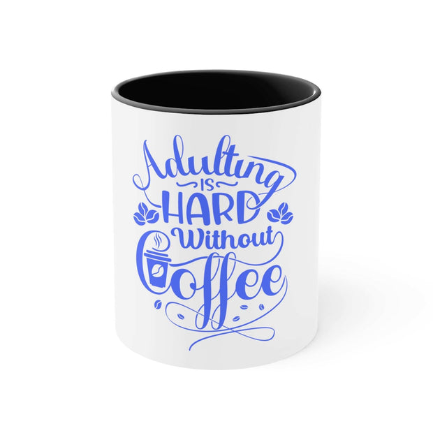 White ceramic Adulting Accent Mug with black interior and blue "Adulting is hard without coffee" text design
